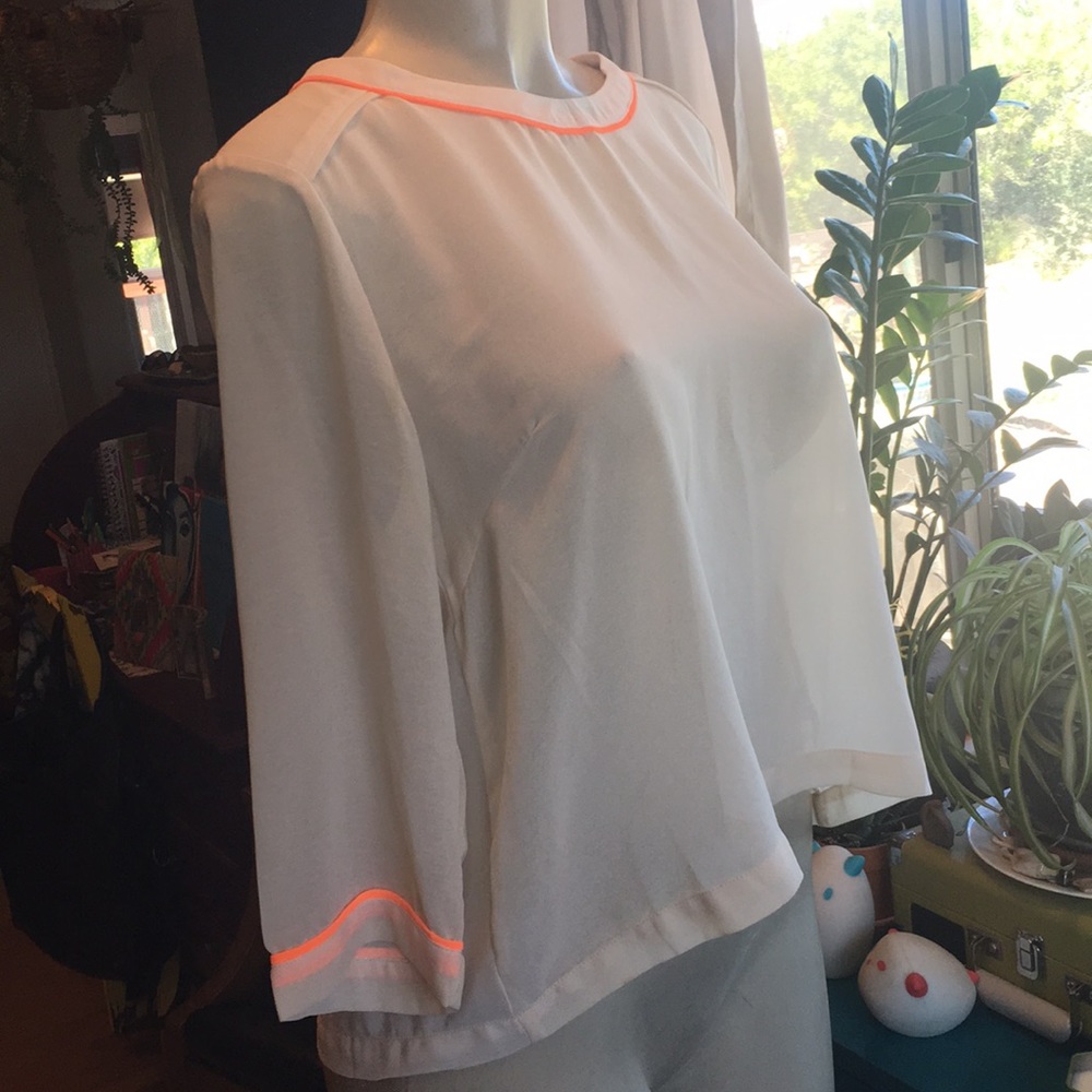 Beautiful cream blouse with orange trim